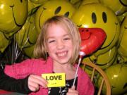 Salmon Creek: Taryn Larsen, 8, signed cards for each balloon given to patients spending Christmas at Legacy Salmon Creek Medical Center.