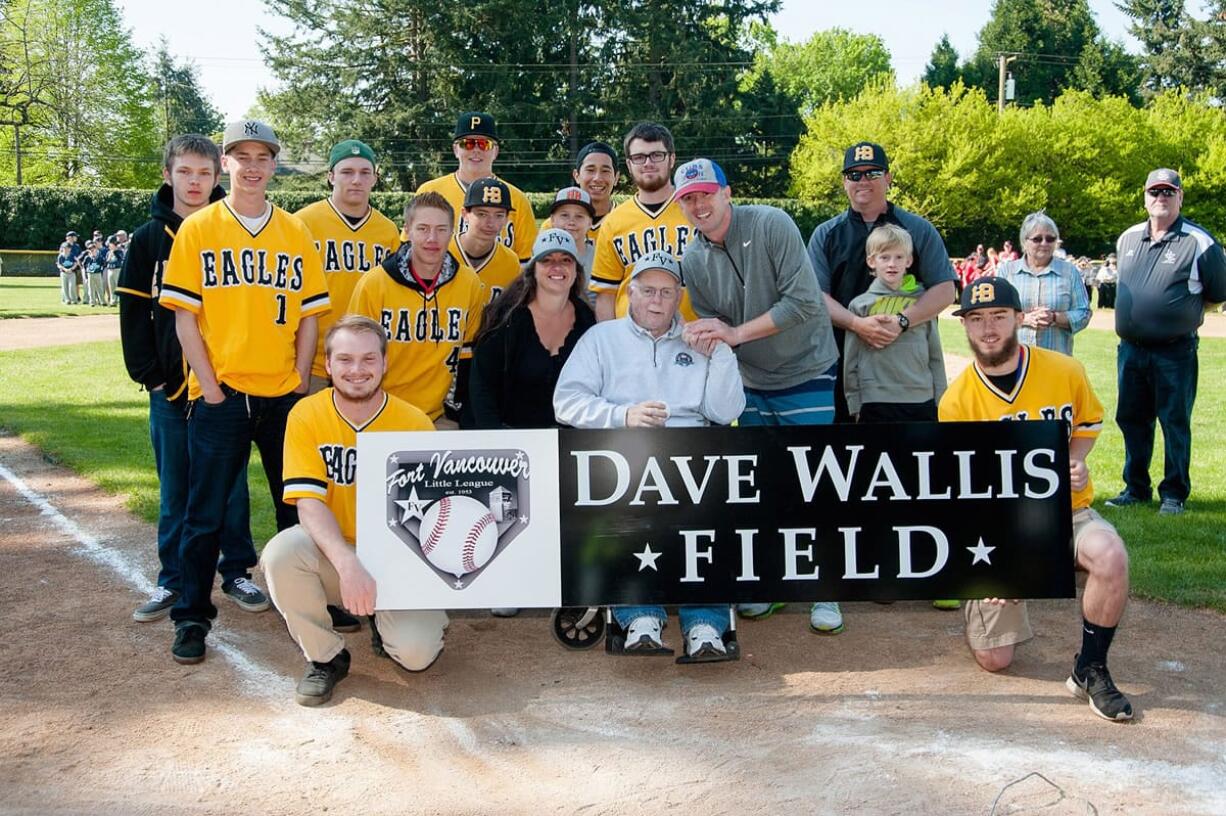 Dave Wallis, center, was recognized on April 18 by Fort Vancouver Little League, which named one of its fields &quot;Dave Wallis Field&quot; to honor his 30 years of service.