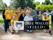 Dave Wallis, center, was recognized on April 18 by Fort Vancouver Little League, which named one of its fields &quot;Dave Wallis Field&quot; to honor his 30 years of service.