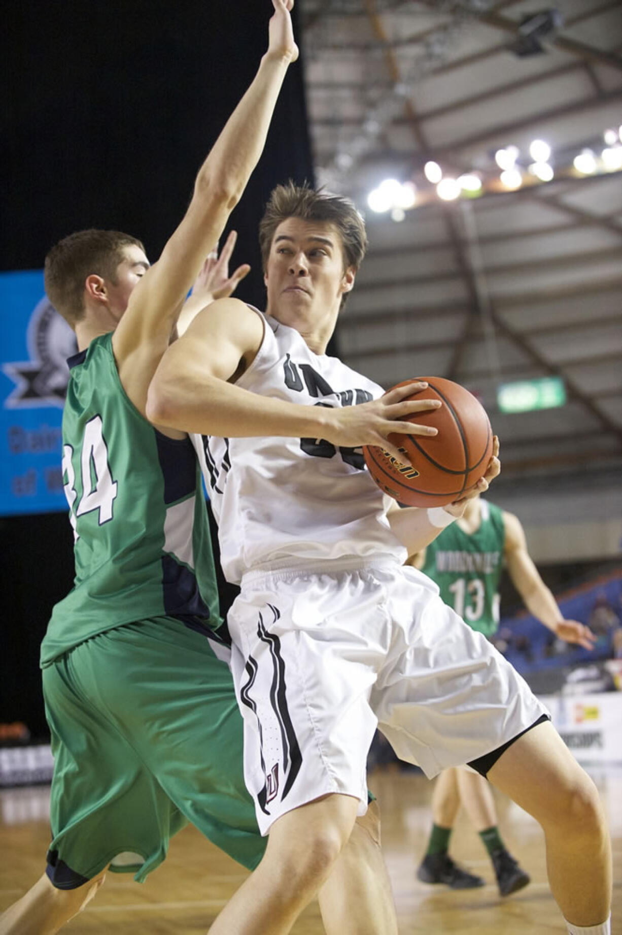 Riley Hawken makes a move to the basket as Union beats Woodinville 69-45 to win third place at the 2015 WIAA Hardwood Classic 4A Boys tournament at the Tacoma Dome, Saturday, March 7, 2015.