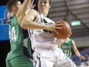 Riley Hawken makes a move to the basket as Union beats Woodinville 69-45 to win third place at the 2015 WIAA Hardwood Classic 4A Boys tournament at the Tacoma Dome, Saturday, March 7, 2015.