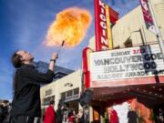 Fire breather Ian Roy performs Sunday as guests arrive at the Kiggins Theatre for Vancouver Goes Hollywood.