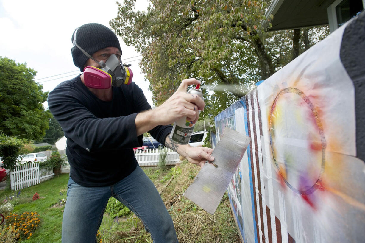 Allen Russell says he hardly ever picked up a paintbrush before taking a notion this summer to start spraying murals on the walls and fence around his yard.