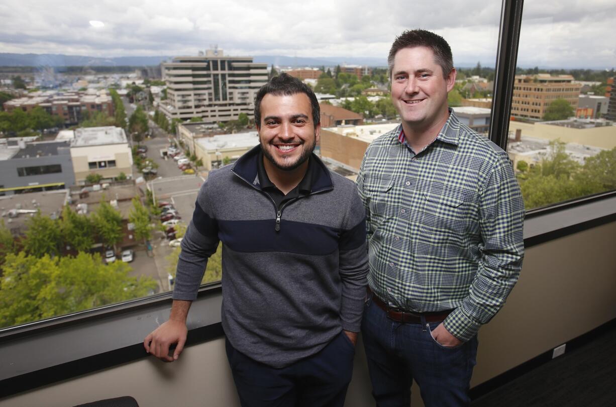 Photos by Steve Dipaola for the Columbian
DiscoverOrg co-founders Henry Schuck, left, and Kirk Brown have chosen downtown Vancovuver as the corporate home for their technology company, saying it offers large advantages over Portland. &quot;It is nice to feel that our presence here is making a real impact on the city,&quot; Schuck says in an essay.