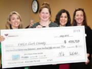 Shumway: The YWCA Clark County received a check from Classic Wine Auction on May 27.