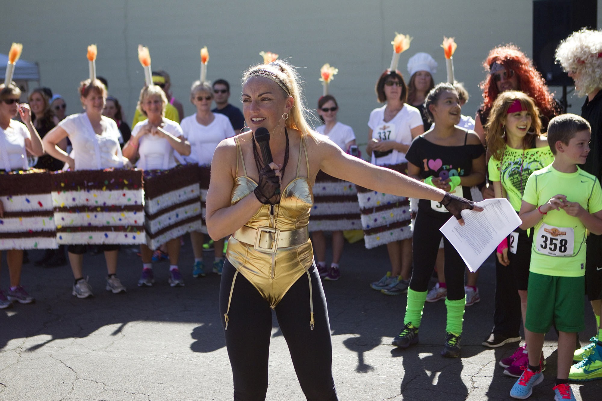 Sherri McMillan, the owner of Northwest Personal Training, amps up the crowd and gives the runners a rundown of how the obstacle course works before the race begins.