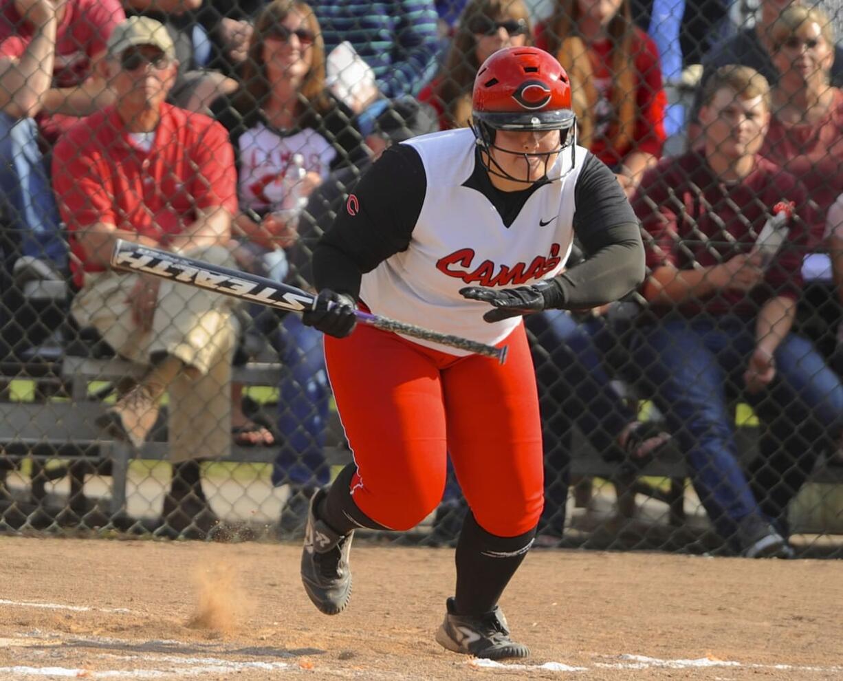 Camas's Katie Schroeder (14) hits against Battle Ground in the 4A District softball championship game in Battle Ground on Wednesday.