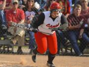 Camas's Katie Schroeder (14) hits against Battle Ground in the 4A District softball championship game in Battle Ground on Wednesday.