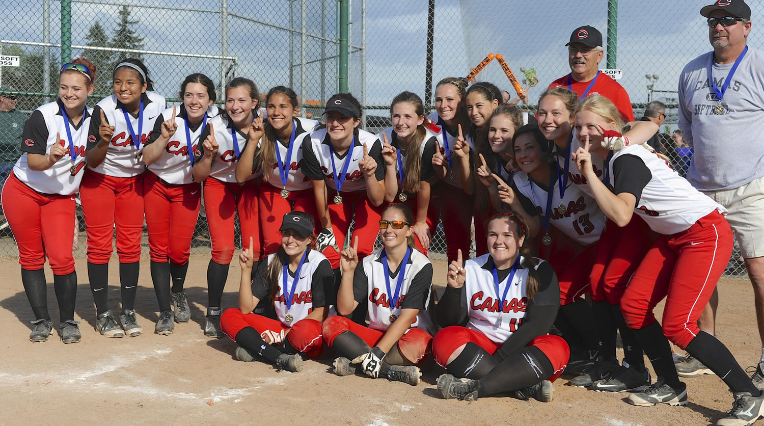 Camas players pose for a photo as they celebrate their 3-0 win over Battle Ground  in the 4A District softball championship game.