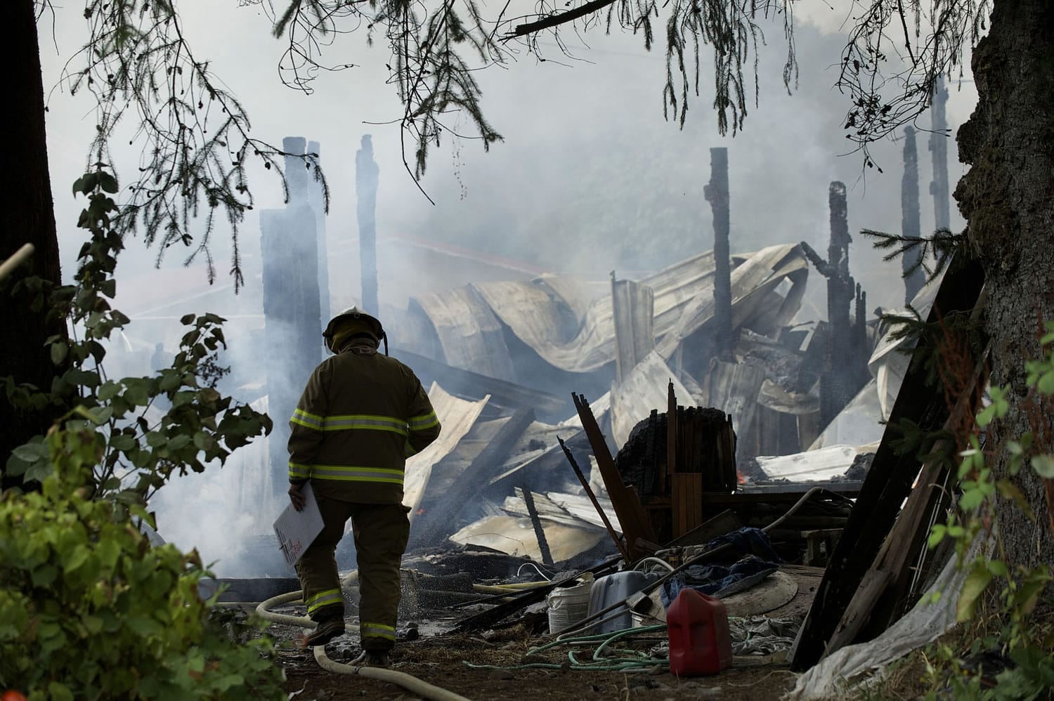 Firefighters from Clark County Fire and Rescue, Vancouver Fire and Clark County Fire District 3 battle a shop fire at 12100 N.E.