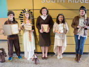 Ridgefield: Nick Radosevich as Meriwether Lewis, Taylor Skinner as Cleopatra, Jaelyn Sotelo as Anne Frank, Cami McGravey as Queen Victoria and Maddy Bisla as Amelia Earhart for a recent biography project at South Ridge Elementary School.