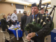 Timothy Gunn plays bagpipes to welcome in the haggis at the inaugural Robert Burns Dinner at Clark College.