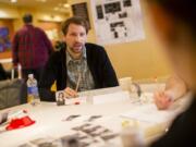 Michael Rude plays Night Witches, a new indie role-playing game based on World War II female fighter pilots in the Soviet army, while at GameStorm on Sunday at the Hilton Vancouver Washington.