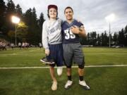 Jared Oman, left, shown, Wednesday, October 29, 2014, is a sophomore athlete from Skyview who recently had his left leg amputated.