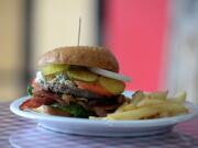 The blue cheese burger is served with fries Aug.