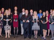 Salmon Creek: Former Washington State University Vancouver students hold the 2014 Notable Alumni Honors they received at the university's 25th anniversary celebration dinner on Nov.