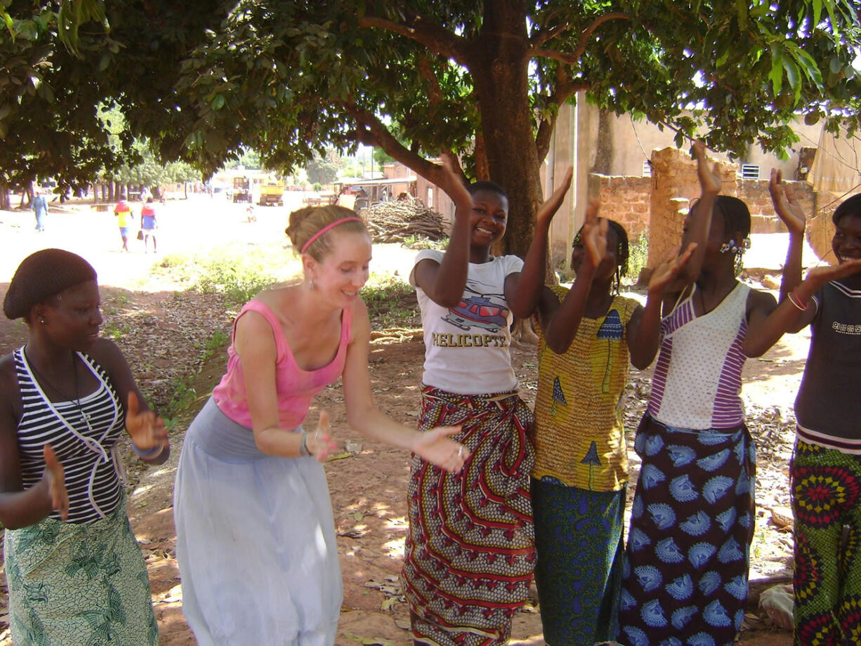 West Hazel Dell: Vancouver's Royce Andrews, second from left, spends time with young women during her two-year Peace Corps service in Burkina Faso.