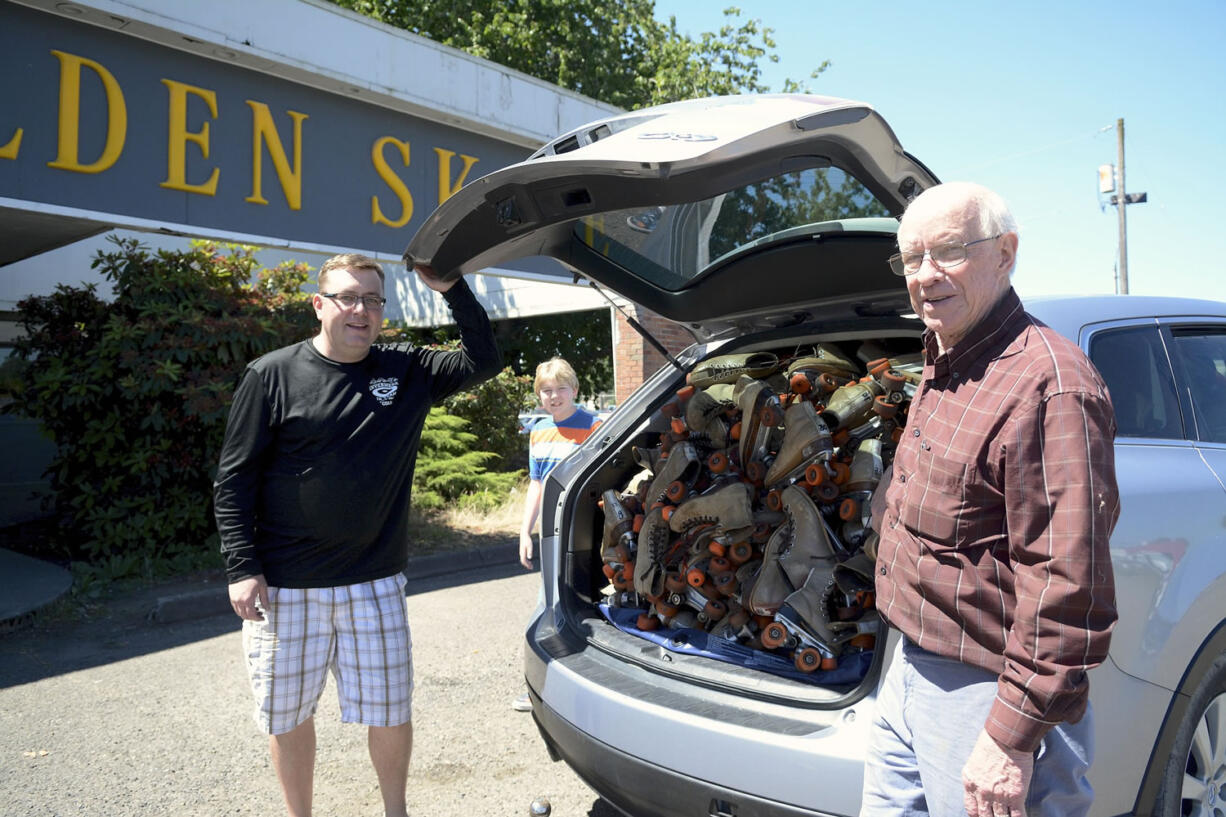 Jason Stevens, left, and Golden Skate owner John Wainwright managed to stuff 150 pairs of skates into Stevens' station wagon Thursday morning for the 700-plus-mile journey to their new home.