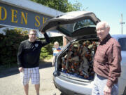 Jason Stevens, left, and Golden Skate owner John Wainwright managed to stuff 150 pairs of skates into Stevens' station wagon Thursday morning for the 700-plus-mile journey to their new home.