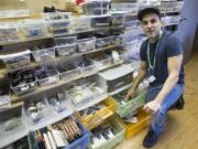 Ramsey Hamide of Main Street Marijuana looks over the large amount of stock available at the store a few weeks ago.