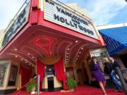 Greater Vancouver Chamber of Commerce President and CEO Kelly Parker walks toward Main Street as Braden and Amy Hurt of Vancouver arrive at the Academy Awards viewing party at Kiggins Theatre in 2014.