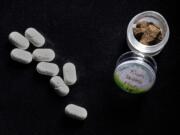 Hydrocodone, left, to treat chronic migraine headaches, and marijuana hash used to treat insomnia, both belonging to &quot;Christopher,&quot; who suffers from both.