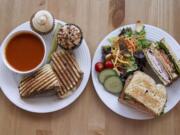 A roast beef panini, tomato basil soup and a Cafe House sandwich is served alongside chocolate coconut caramel and pumpkin pie cupcakes at the WildFlour Cafe and Cupcakes in Washougal.