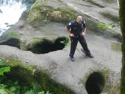 A police officer surveys an area known as the Potholes in Camas in 2015.