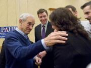 Republican presidential candidate Ron Paul meets supporters after speaking during a rally at the Hilton Vancouver Washington.