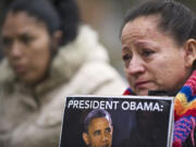 Zachary Kaufman/The Columbian
Anna Maldonado, 54, of Vancouver, joins other advocates of immigration reform during a rally outside Rep. Jaime Herrera Beutler's Vancouver office on Thursday.