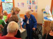 La Center: Margaret Colf Hepola, right, chats with Alexa Talvitie-Lynch at the La Center Community Library on June 25.