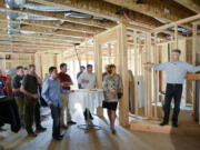 Ariane Kunze/The Columbian
Mark LaLiberte, right, a building science expert, led an informational tour on Thursday in a home under construction by Urban NW Homes in Ridgefield. He explained what builders are doing to make homes more sustainable, energy efficient and durable.