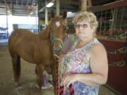 Nancy Elder got to her Brush Prairie stables early Wednesday morning, but waited until other people arrived to search the stalls and barn for an escaped inmate.