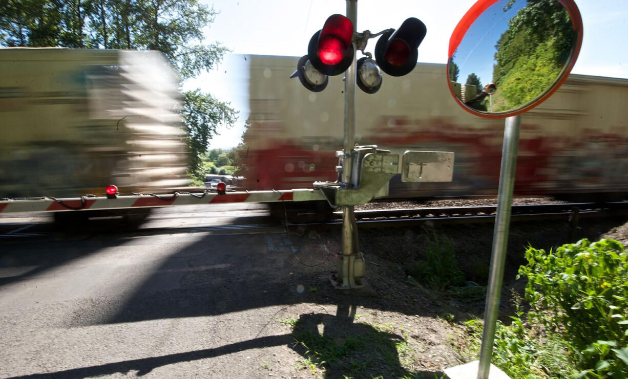 A train passes the crossing at Northwest 122nd Street in Felida.