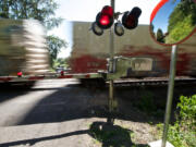 A train passes the crossing at Northwest 122nd Street in Felida.