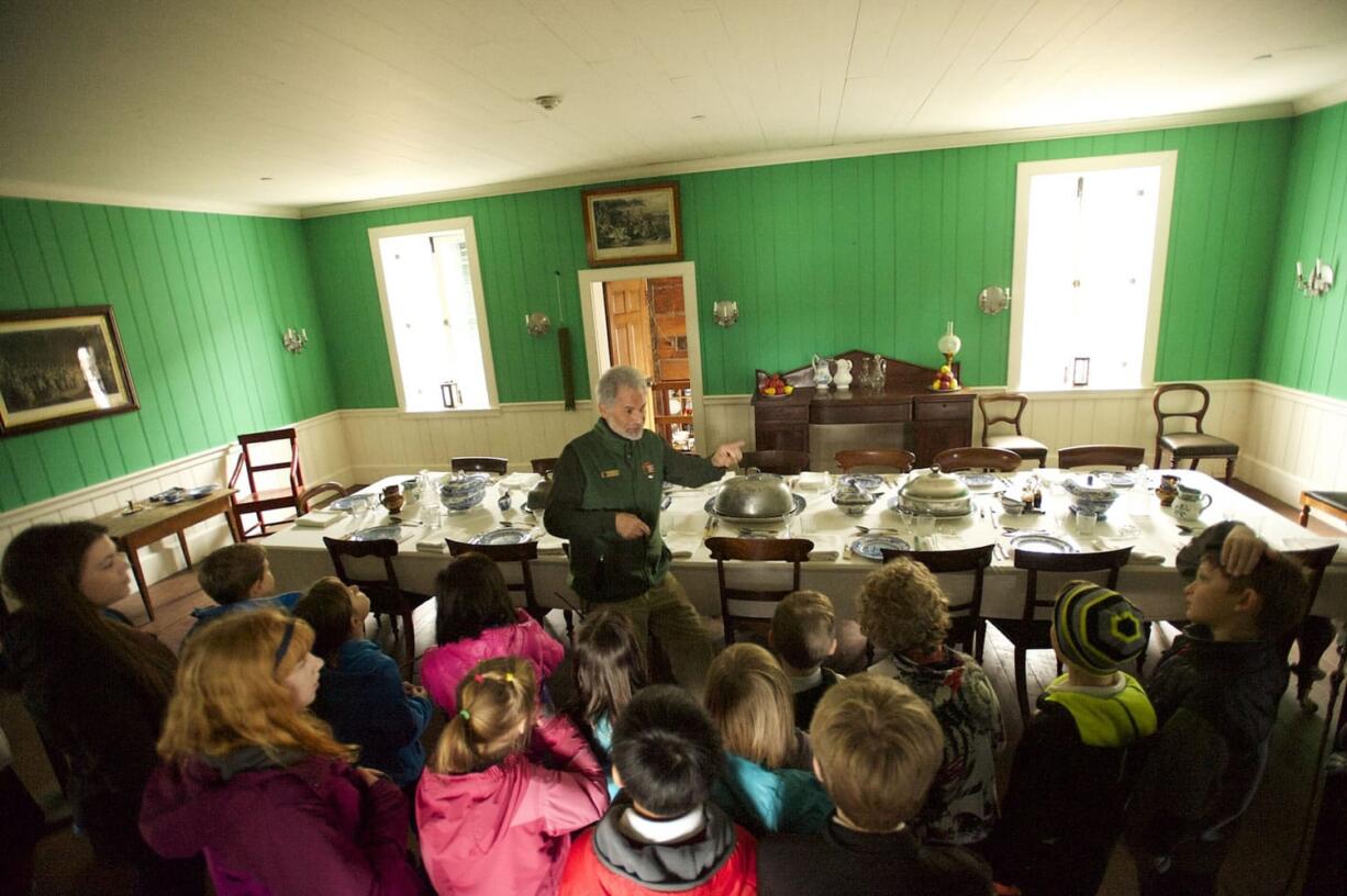 Students from Cascade Heights Public Charter School in Clackamas, Ore., visit the dining room in the re-created chief factor's house at Fort Vancouver on Wednesday. Policies established there affected an area of 600,000 square miles.