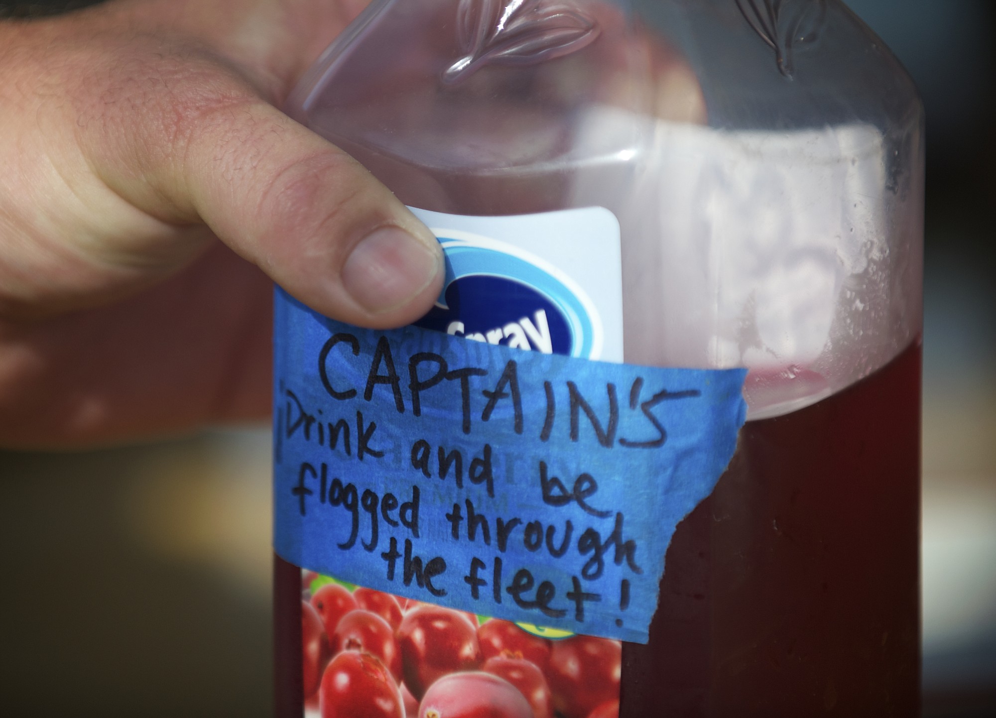 Hawaiian Chieftain Capt. Jordan Smith holds on to his bottle of cranberry juice while on a cruise on the Columbia River on Saturday May 25, 2013.