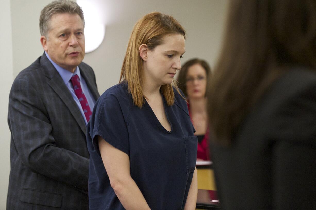 Evergreen High School drama teacher Stephanie McCrea (right) makes a first appearance in Clark County Superior Court on suspicion of four counts of child rape.