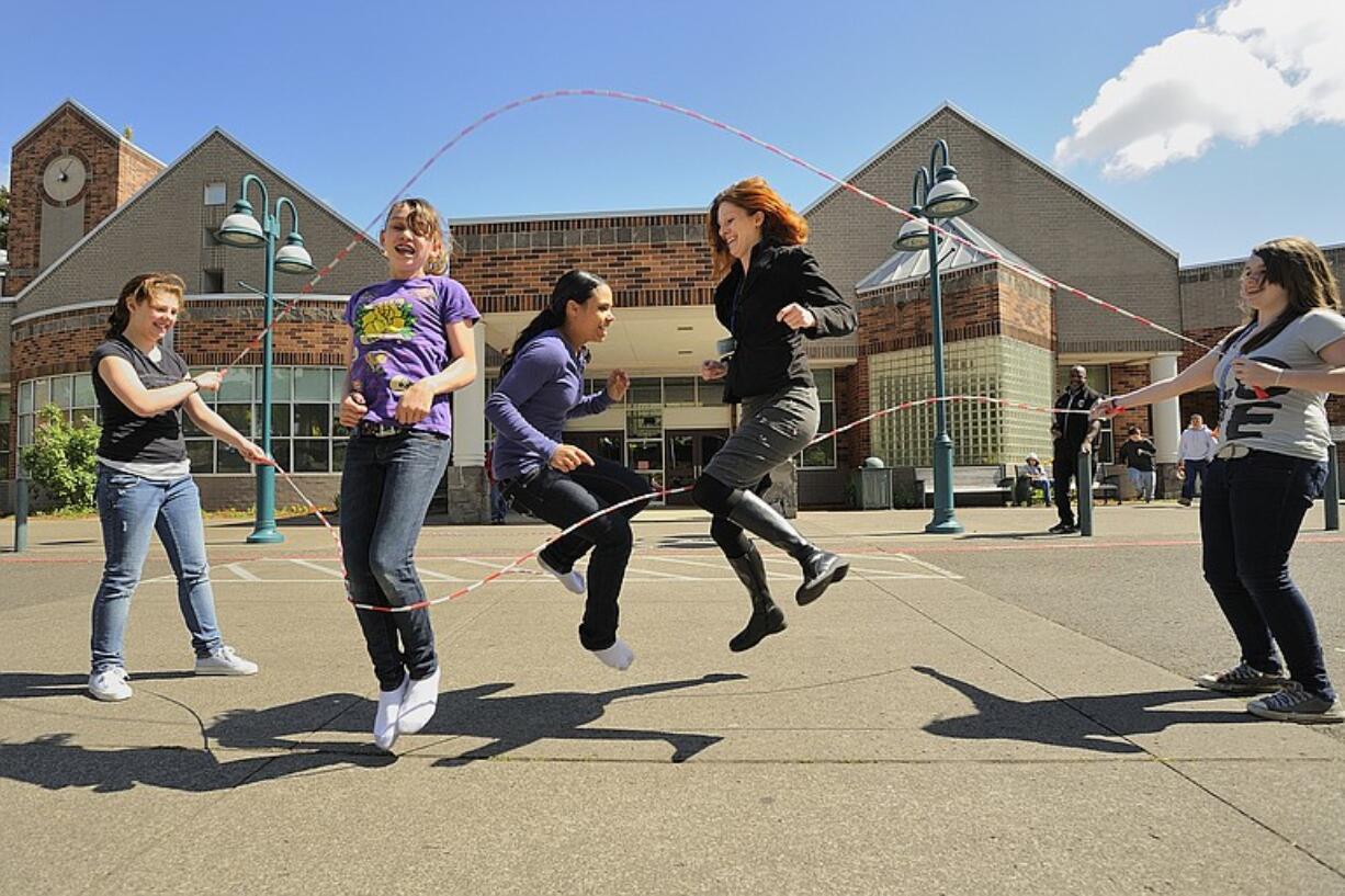 Counselor Megan Bledsoe double dutches (jump ropes) with her students last year  at Discovery Middle School in Vancouver.