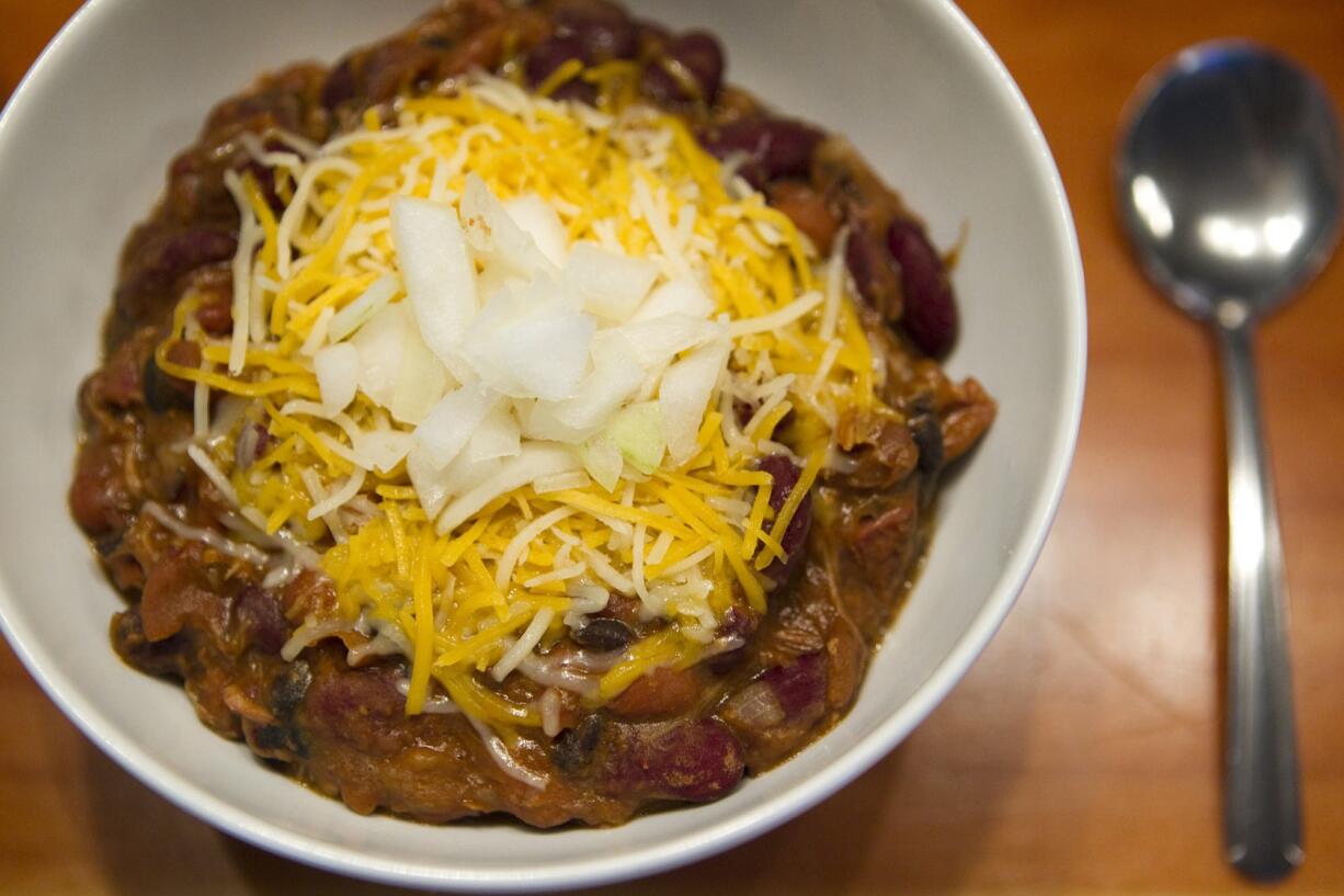 A bowl of red chili with beans, beef, cheese and onions is served at The Hoosegow, a new restaurant just south of the courthouse.