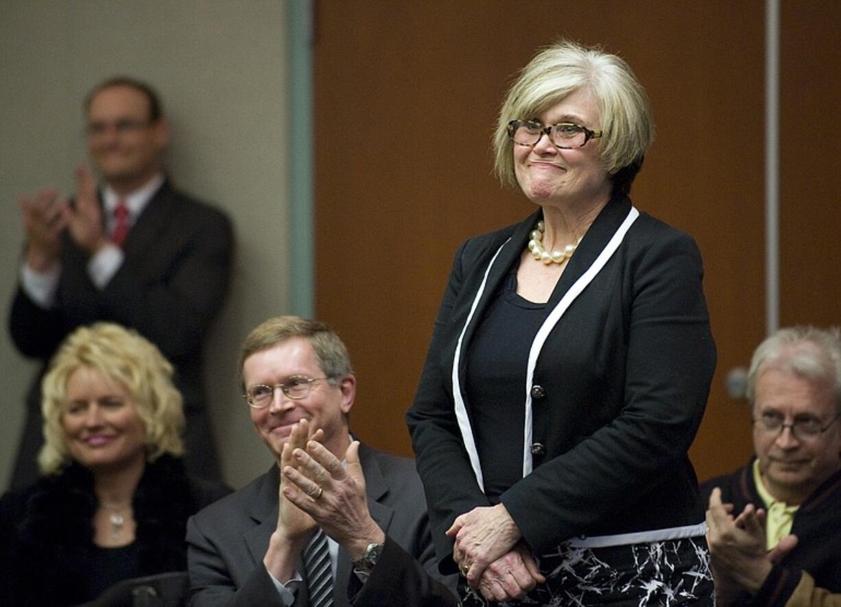 Sharon Wylie stands after county commissioners voted to name her to the Legislature Wednesday afternoon.