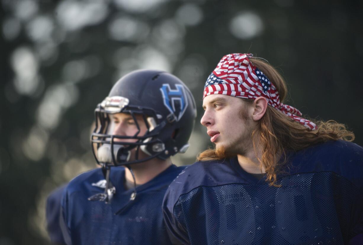 Hockinson defensive lineman Peter Schultz-Rathbun, right, is back with the team after missing last season due to a brain tumor.