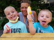 Jack Conover, 7, left, enjoys some ice cream with his grandma Tina Conover and brother, Patrick Anderson, 4, at Seattle Childrenu2019s Hospital. Tina Conover and Patrick were visiting Jack after his June 14 heart transplant.