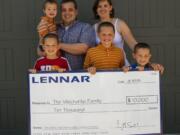 Orchards: The Mischenko family won $10,000 as part of the Unbox Your Home video contest after filming their first moments in their new home, built by developer Lennar Corp. Back row, from left: Seth, Craig and Grace Mischenko. Front row, from left: Timothy, Micah and Joseph Mischenko.