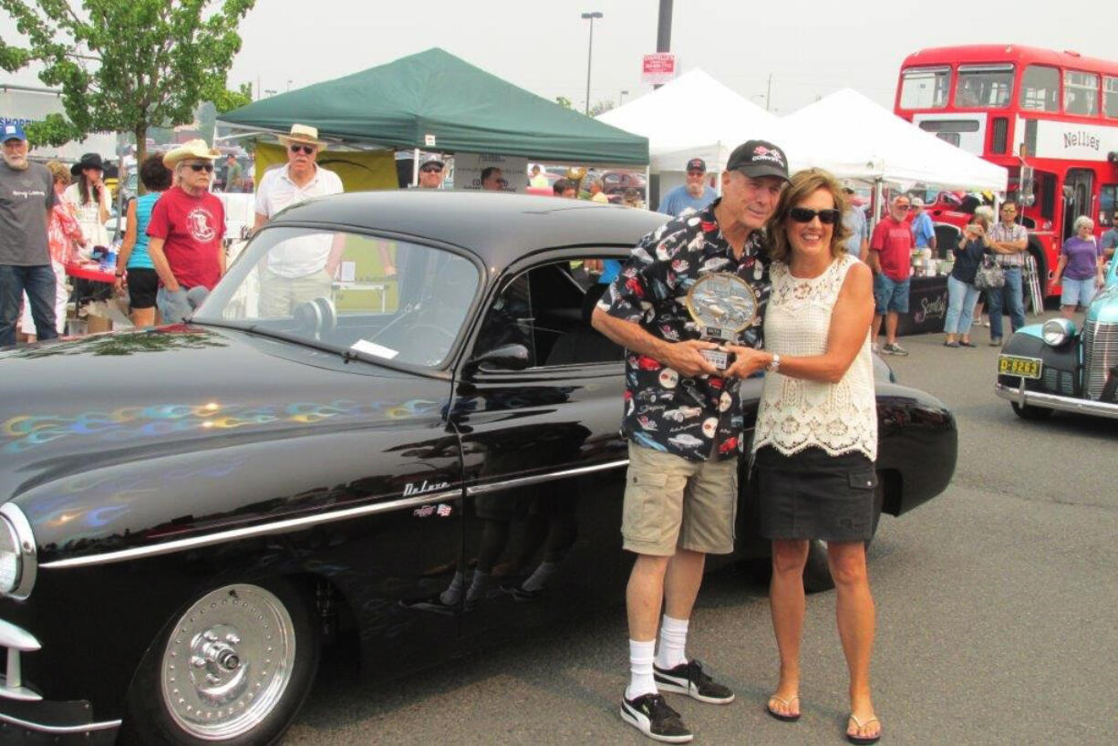 East Vancouver: Rick Davidson, left, and Rep. Lynda Wilson, R-Vancouver, at the Veterans Court Board's cruise-in on Aug. 22, where Davidson won Best Muscle.