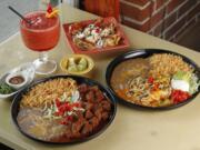 Chile colorado, left, enchiladas rancheras and banana chimi for dessert at Jorge's Tequila Factory.