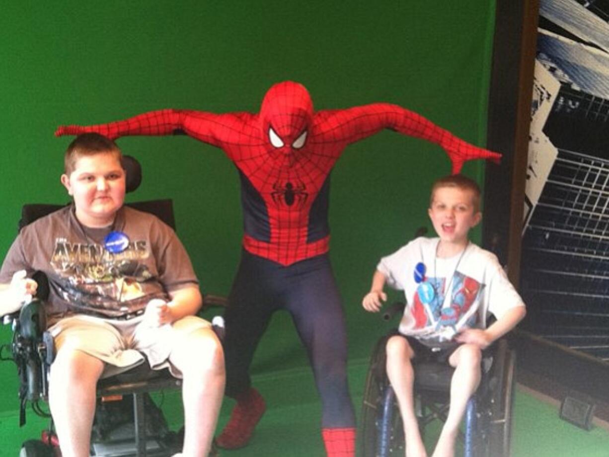 Cascade Park West: Josh, 13, left, and Luke Jensen, 11, hang out with Spider-Man during Luke's Make-A-Wish trip to Disney World in Florida.