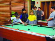 Clark County: Teens play pool at Firstenburg Community Center during a Friday Teen Late Night program event, which was recently supported by a $5,000 grant from Wells Fargo.