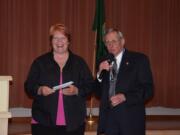 Green Meadows: Northwest Corvette Association of Vancouver President Ron Dietz presents a $3,000 donation Nov.