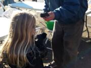 Esther Short: A 6-year-old girl hands out gloves to a homeless man during the Nov.